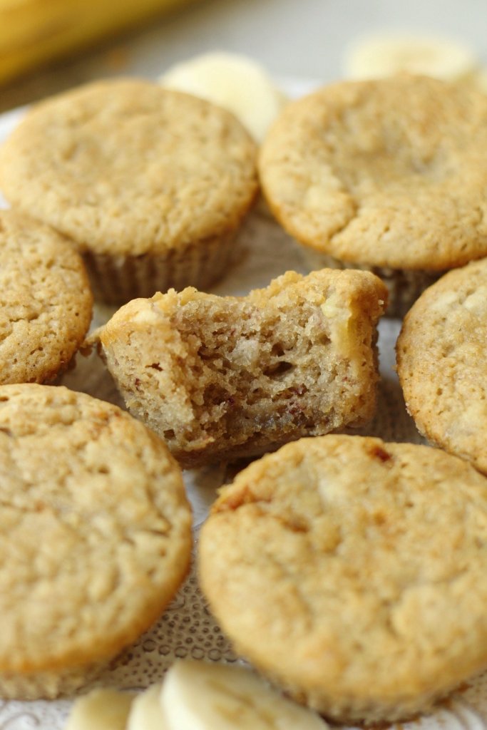 grain-free banana bread muffins with bite taken out to show texture