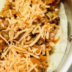 inside of a vegan sweet potato black bean quesadilla with vegan cheese on top