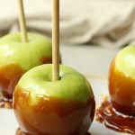 finished vegan caramel apples on a small tray