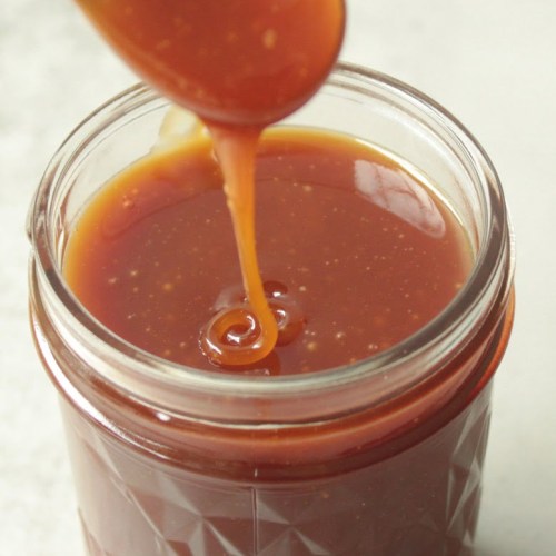 Finished vegan caramel sauce in a glass container