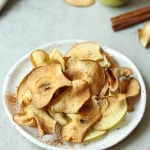 air fryer apple chips on a white plate