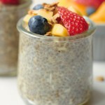 vegan coconut mango chia pudding topped with fruit and granola