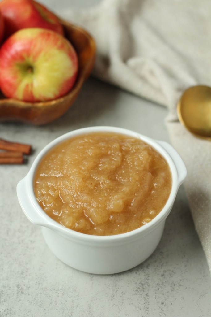 easy crockpot applesauce in a small white bowl