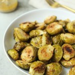 roasted maple dijon brussels sprouts in a white bowl