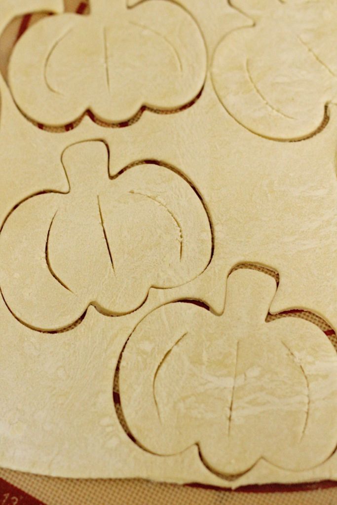 puff pastry with pumpkin shapes cut out and slits for venting mini vegan pumpkin pies