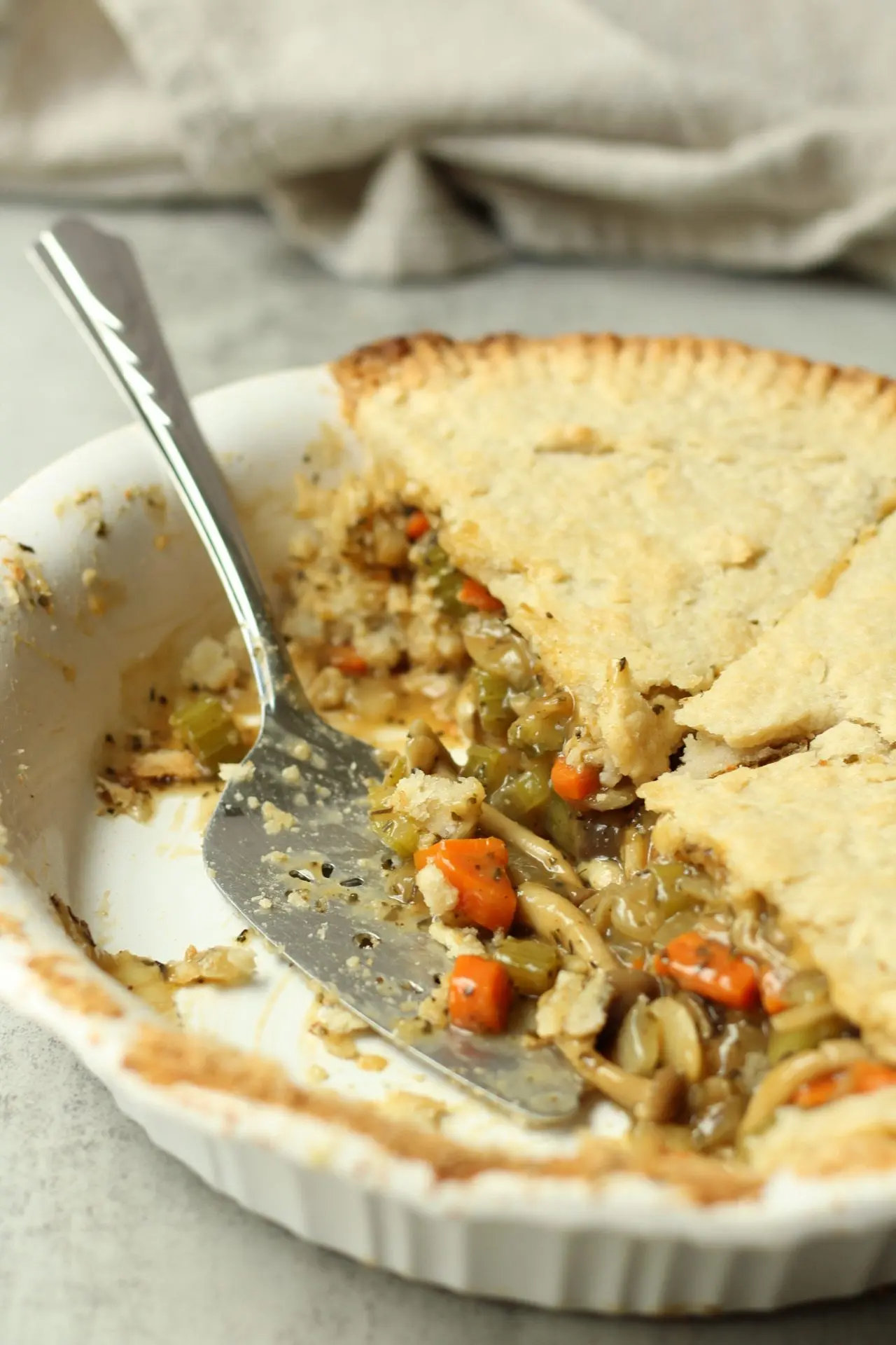 vegan mushroom pot pie with serving spoon