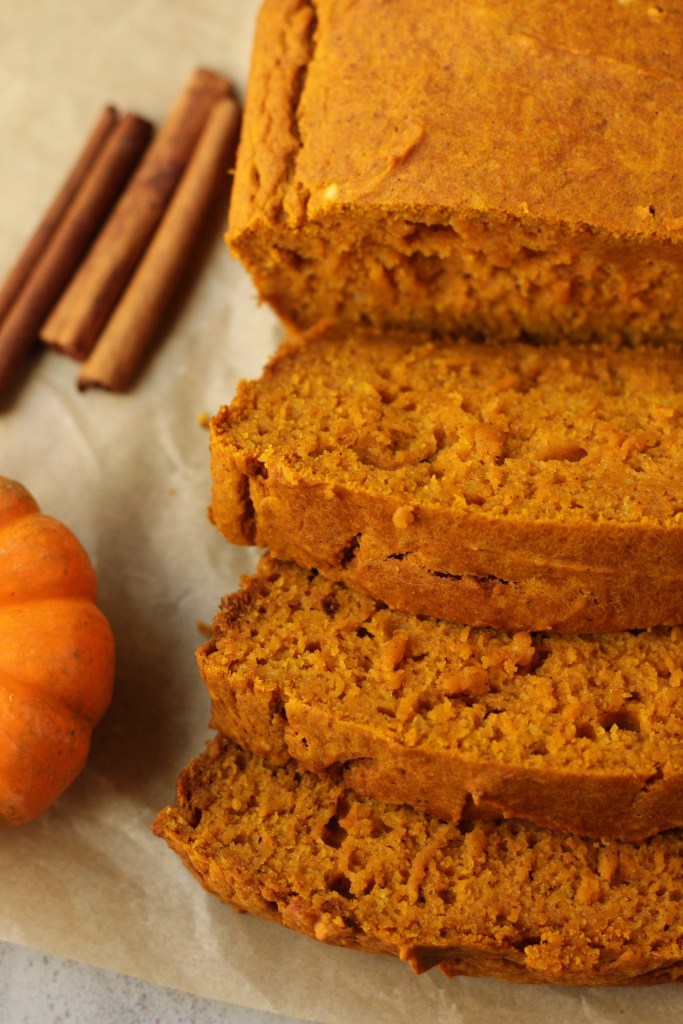Finished loaf of vegan pumpkin bread close up to show slices