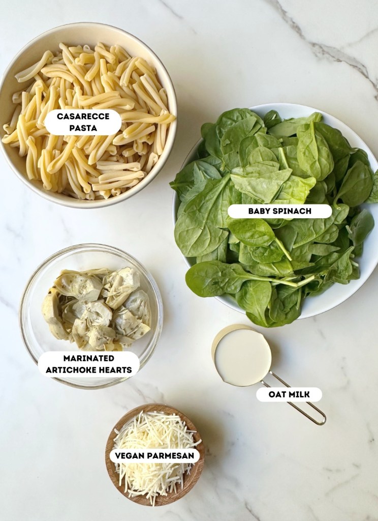ingredients for creamy vegan spinach artichoke pasta