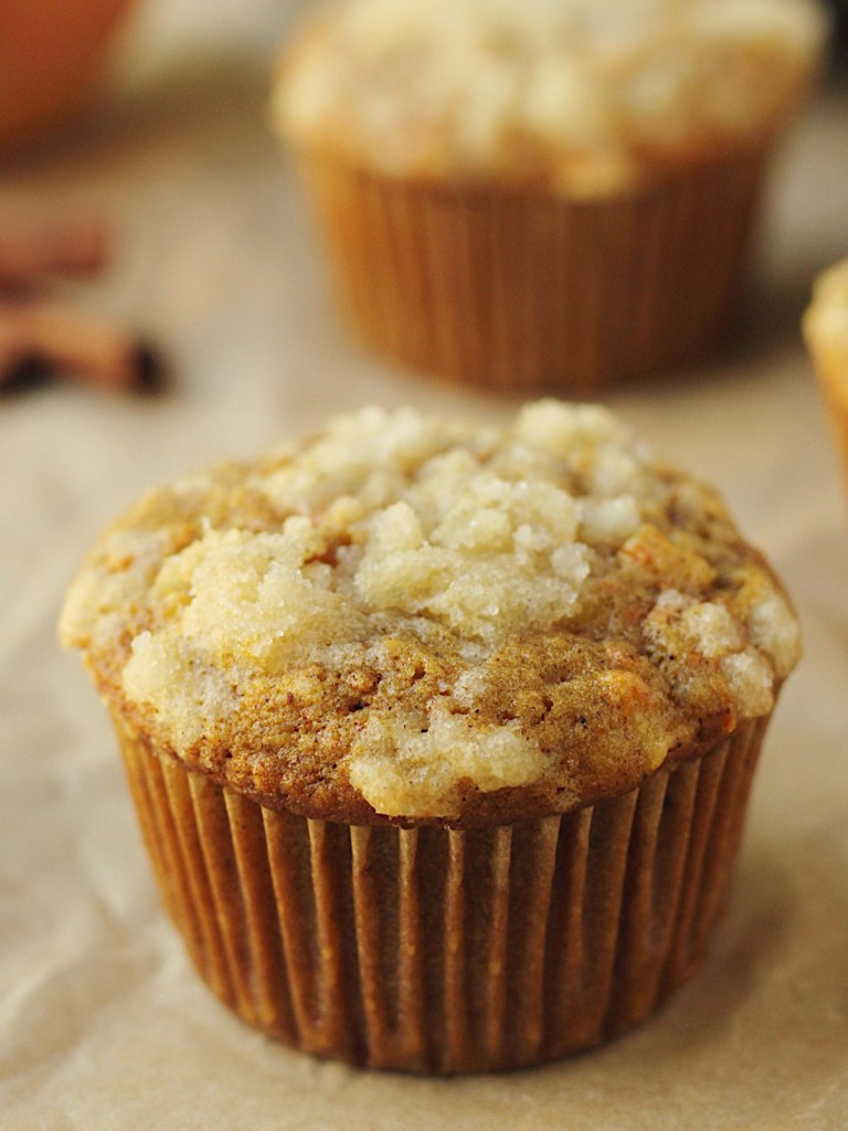 vegan carrot apple muffin on parchment paper