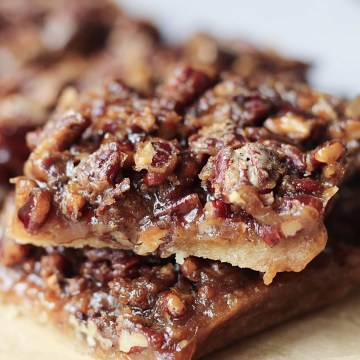 gluten-free vegan pecan pie bars stacked on one another