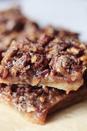 gluten-free vegan pecan pie bars stacked on one another