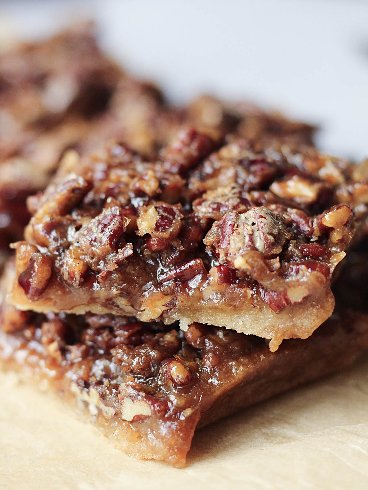 gluten-free vegan pecan pie bars stacked on one another