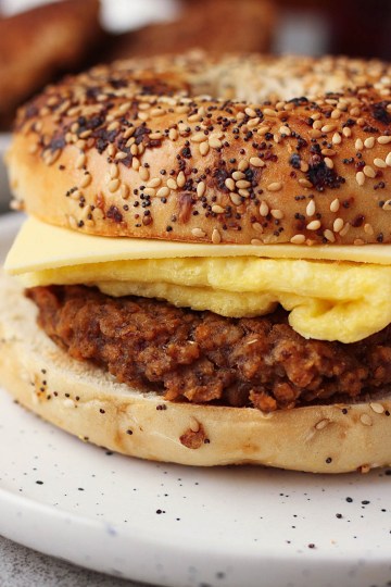 vegan breakfast sausage patty in a bagel sandwich