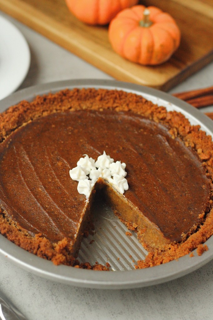 vegan pumpkin pie with slice taken out
