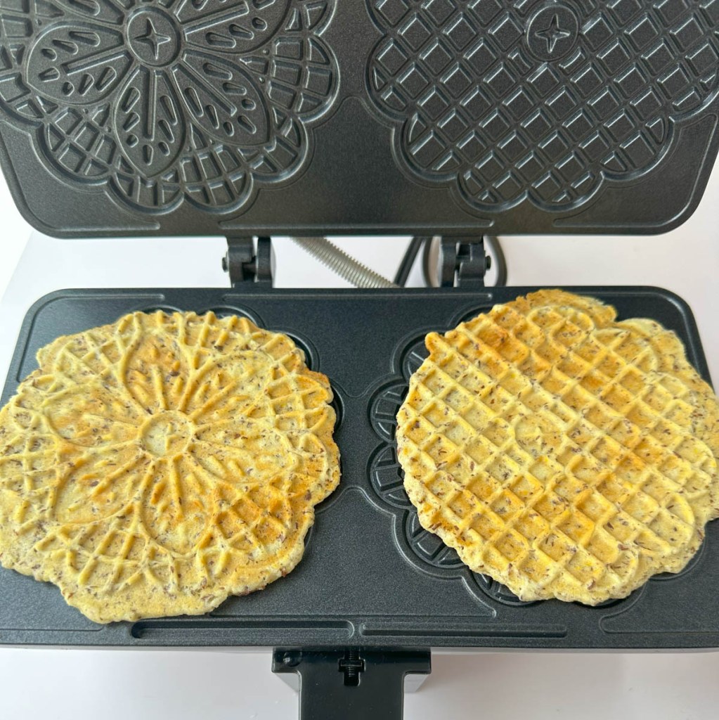 finished vegan lemon pizzelle in a pizzelle maker