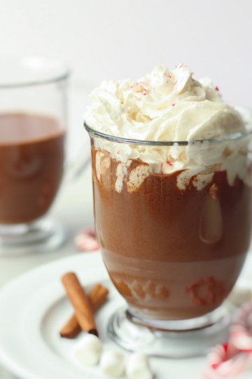 homemade hot chocolate in a glass mug with whipped cream