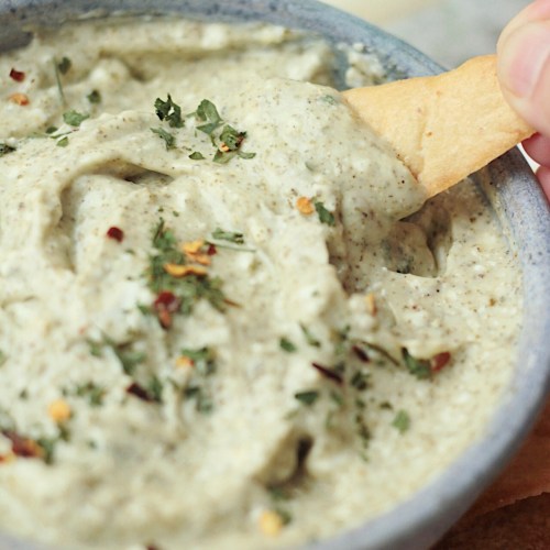 vegan whipped feta dip with chip dipping
