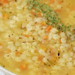 close up vegan pastina soup in white bowl