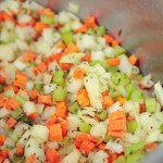 veggies and spices cooking in a pot