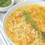 vegan pastina soup in a white bowl