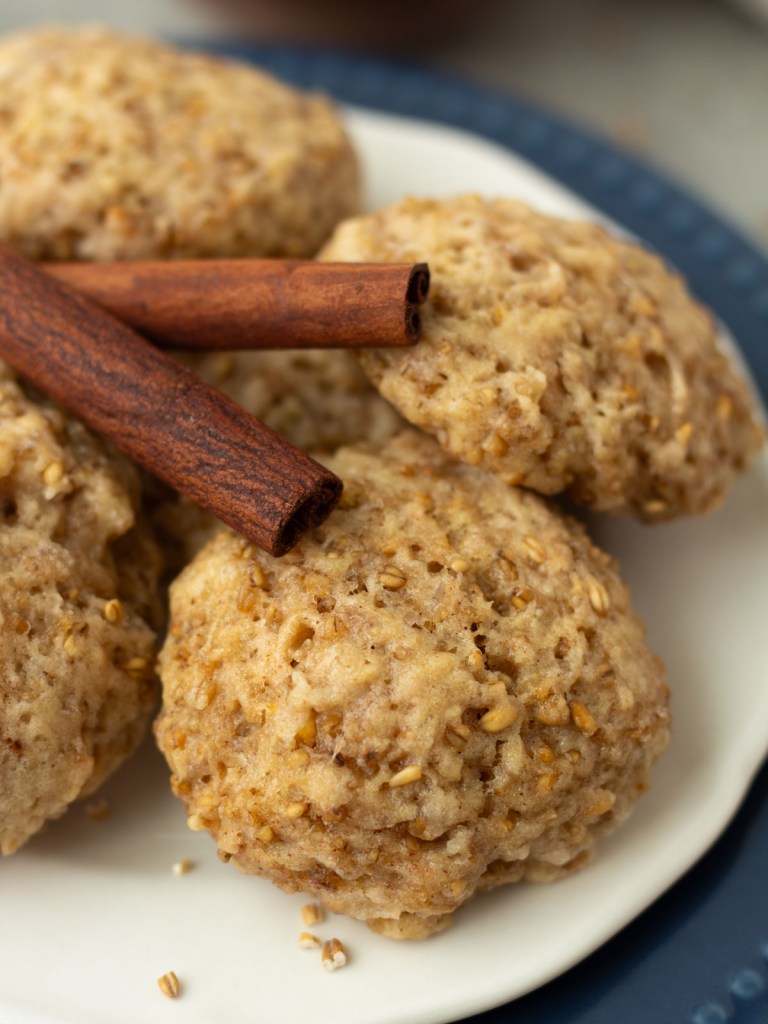 steel cut oatmeal cookies on a plate with cinnamon sticks