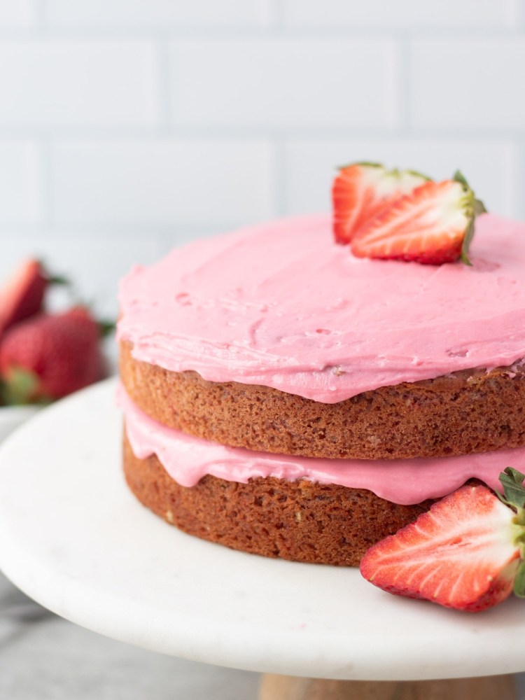 vegan strawberry cake frosted with vegan cake frosting