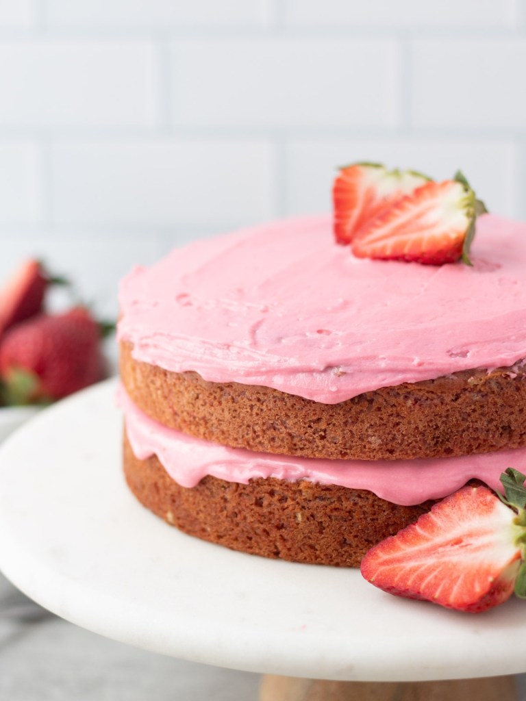 vegan strawberry cake frosted with vegan cake frosting