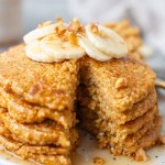 stack of pancakes with slice taken out