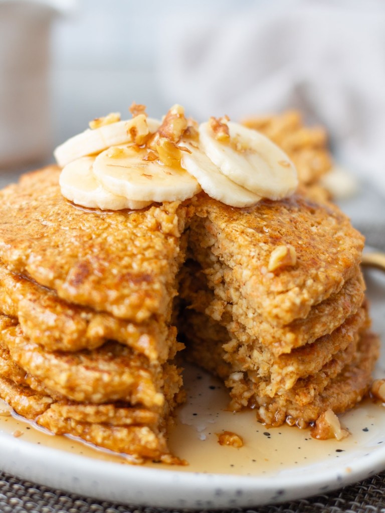 stack of pancakes with slice taken out