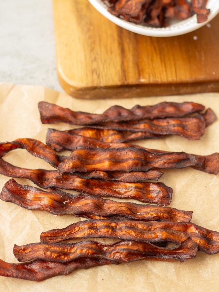 finished vegan carrot bacon on parchment paper