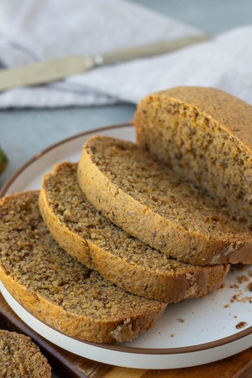 sliced bread machine zucchini bread on a white plate