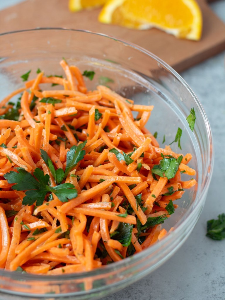 close up Moroccan Carrot Salad in glass bowl