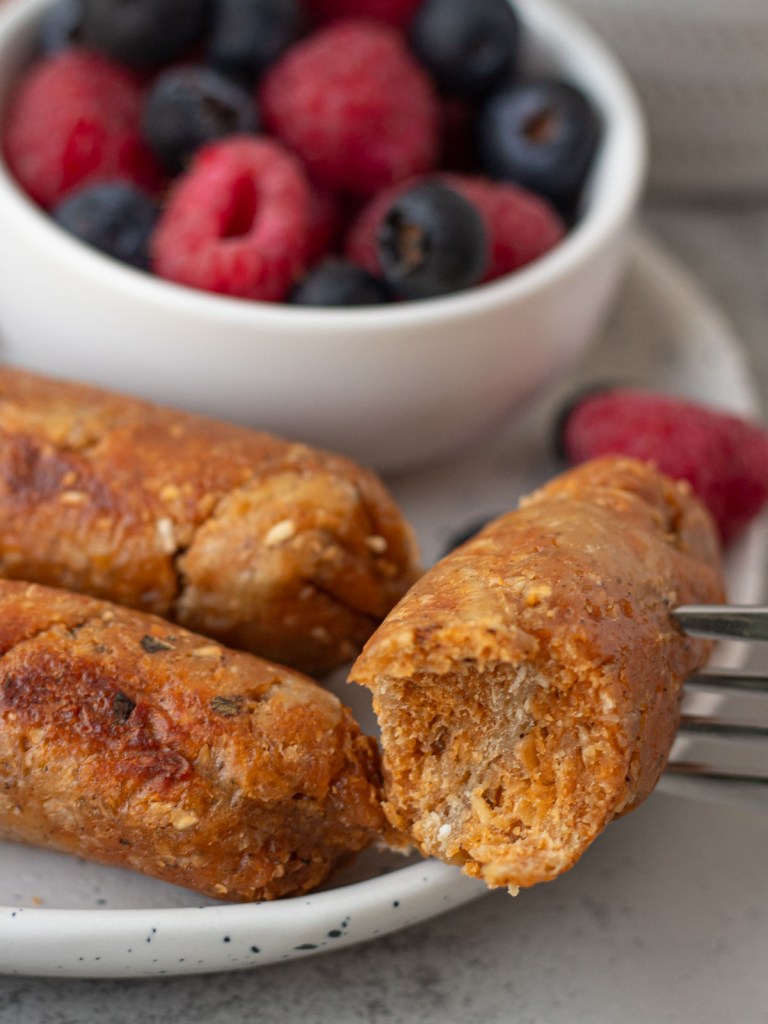 seitan sausage link with bite taken out