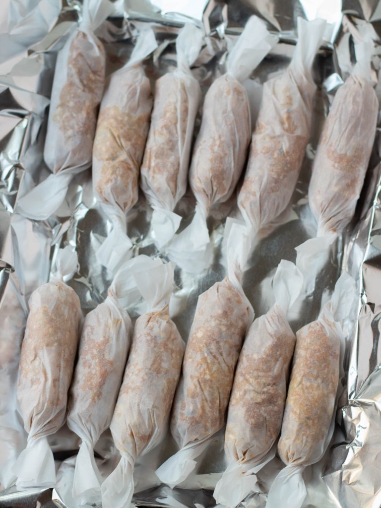 sausage links rolled in parchment paper