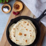 vegan flour tortillas in a cast iron skillet