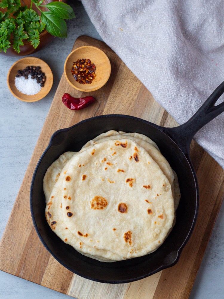 vegan flour tortillas in a cast iron skillet