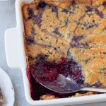 finished vegan blackberry cobbler with spoonful taken out