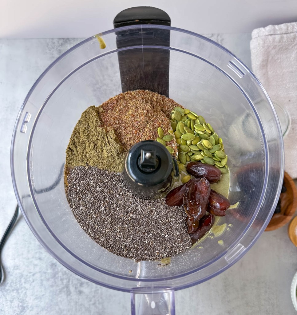 all ingredients for protein bars in a food processor before mixing