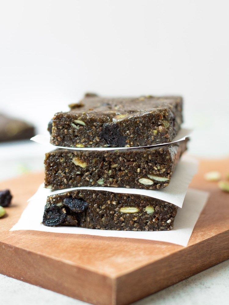nut free protein bars stacked with parchment paper