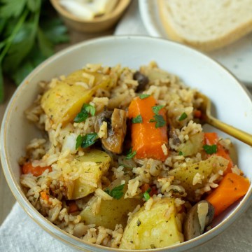 finished bowl of instant pot vegetable casserole in a bowl with fork