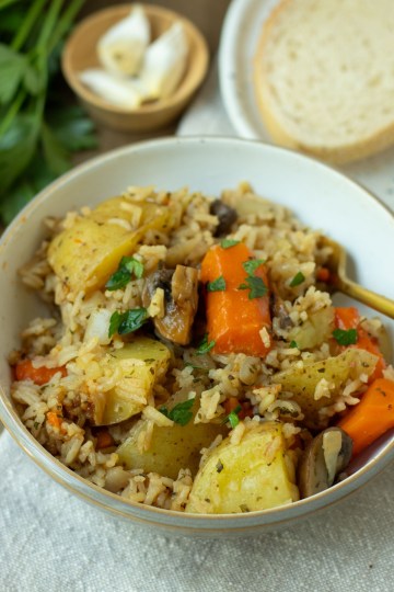 finished bowl of instant pot vegetable casserole in a bowl with fork