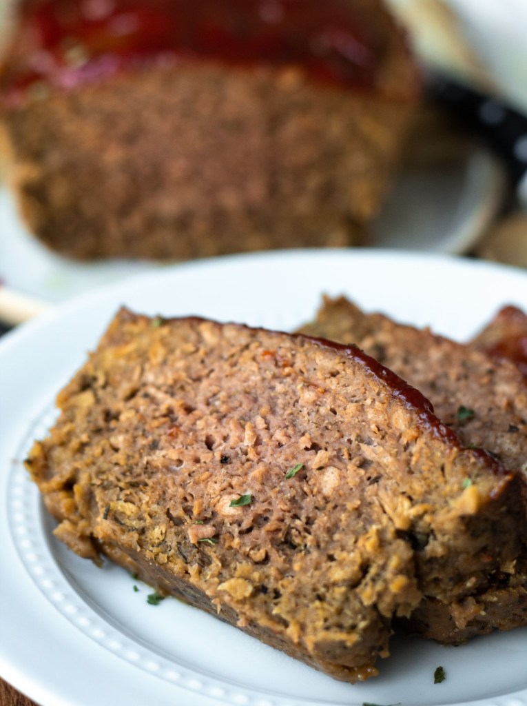 slices of beyond meatloaf on a white plate