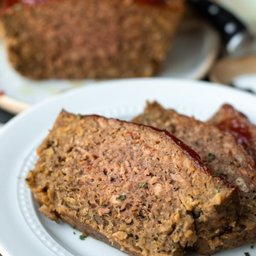 Finished slices of vegan Beyond Meatloaf on white plate